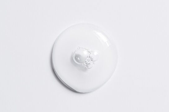 Cosmetic product in the form of a transparent drop. A moisturizing gel or serum for the face.