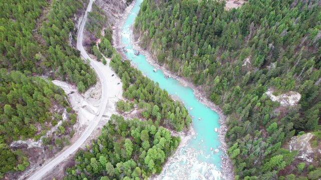 Drone view Parlung Zangbo river running along G318 or China National Highway 318 between Bomi and Baxoi County, Tibet, China, beautiful turquoise water in valley, 4k real time footage travel concept.