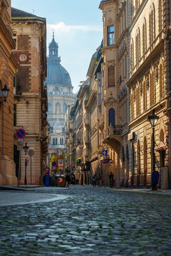 Beautiful street view of historic architecture and cobblestone road in Budapest Hungary with classical buildings and old city atmosphere under bright daylight