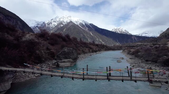 Drone view Parlung Zangbo river running along G318 or China National Highway 318 between Bomi and Baxoi County, Tibet, China, beautiful turquoise water in valley, 4k real time footage travel concept.