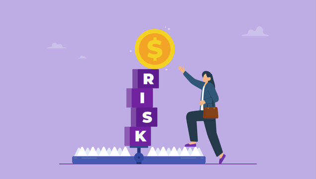 Businesswoman try to pick dollar coin on block cube with the word RISK on bear trap. Risk management, control or assess to lose money in investing concept.