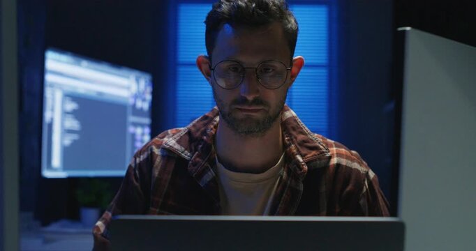 Overworked programmers crafting future tech in cyberspace beyond deadlines.