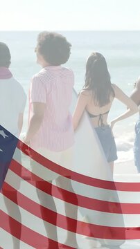 Vertical video: Group facing sea on beach, drifting flag overlay revealing legs, surfer scouting