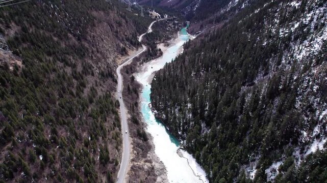 Drone view Parlung Zangbo river running along G318 or China National Highway 318 between Bomi and Baxoi County, Tibet, China, beautiful turquoise water in valley, 4k real time footage travel concept.