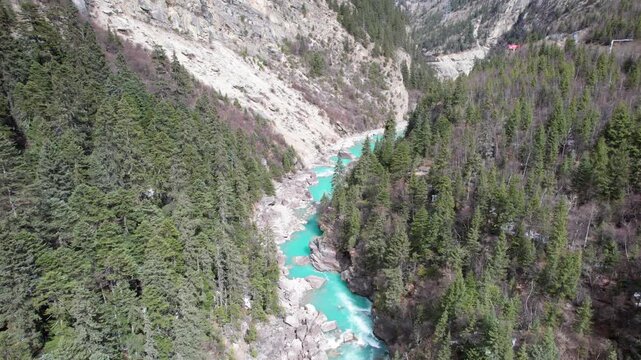 Drone view Parlung Zangbo river running along G318 or China National Highway 318 between Bomi and Baxoi County, Tibet, China, beautiful turquoise water in valley, 4k real time footage travel concept.