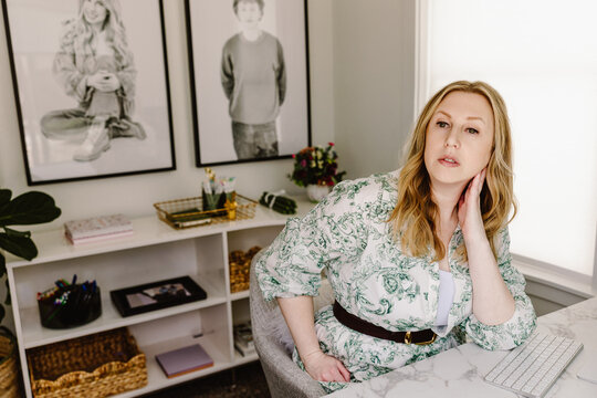 Confident woman working in stylish home office