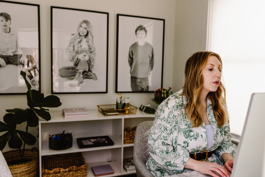 Mid life woman working at home office desk