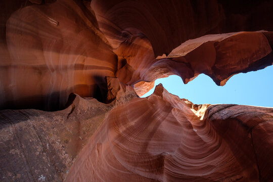 Swirling Sandstone Walls and Blue Sky in a Slot Canyon, Utah