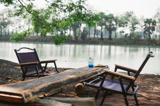 Relaxing by the river scenic nature retreat outdoor lounge chairs calm environment