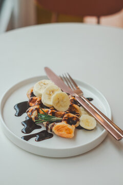 Grilling chicken with bananas cozy kitchen table modern food photography atmosphere