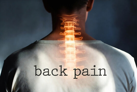 A man experiencing back pain with a graphic representation of his spine overlaid on his back.