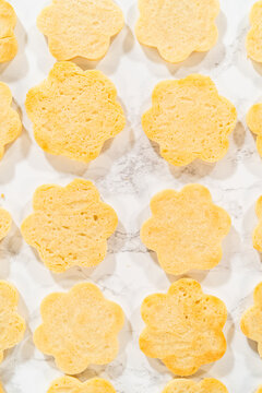 Flower Shaped Cookie Bottoms on Marble Surface