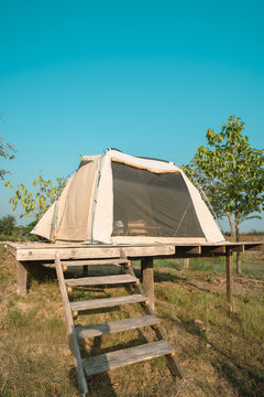 Camping adventure tent setup in nature outdoor glamping experience scenic view