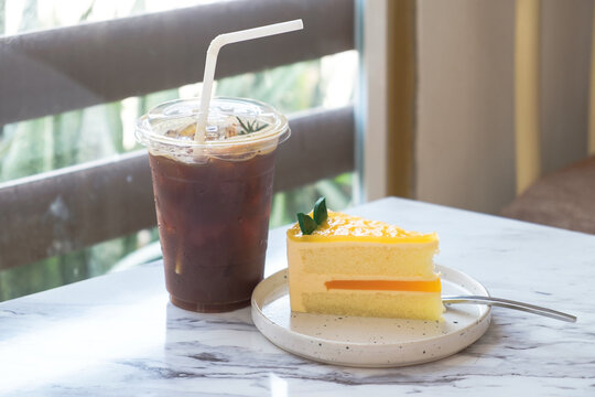 Savoring delicious cake and iced coffee cozy  food photography inviting atmosphere