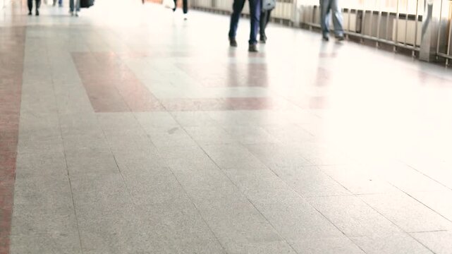 People walking in the train station lobby