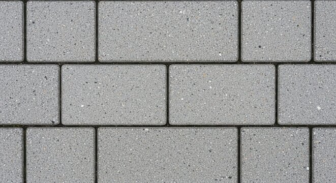 Gray rectangular stone pavers form a geometric pattern on the ground.