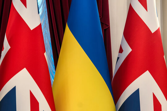 National flags of Ukraine and the United Kingdom displayed ahead of an official diplomatic meeting in Kyiv, Ukraine