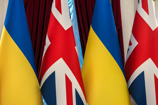 National flags of Ukraine and the United Kingdom displayed ahead of an official diplomatic meeting in Kyiv, Ukraine