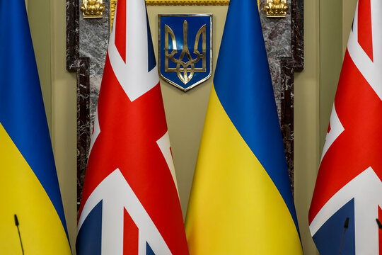 National flags of Ukraine and the United Kingdom displayed ahead of an official diplomatic meeting in Kyiv, Ukraine