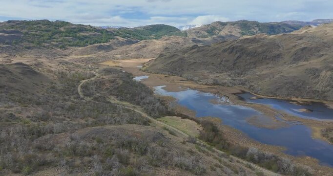 4K video; aerial view with slow panning movement over mountain landscape with lakes, northern Patagonia Chile