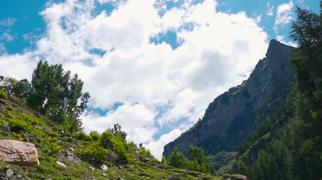 Clouds above the Himalayan mountain peaks during the summer season as seen from Killar town in Chamba district, Himachal Pradesh, India. Scenic natural background with copy space.