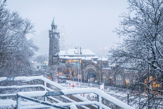 Snowy St. Pauli-Landungsbrucken and clock tower in Hamburg