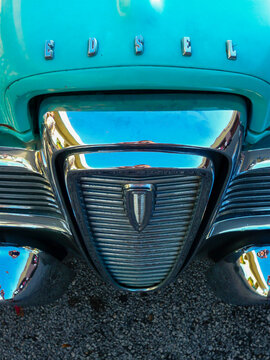 Chrome vertical horse collar grille and lettering detail on a turquoise 1958 Ford Edsel bonnet