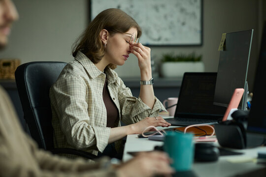Stressed programmer experiencing burnout at office desk
