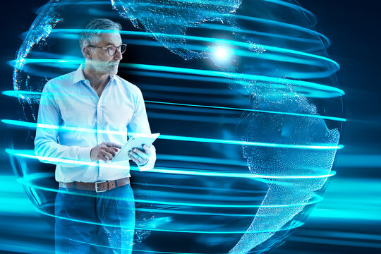 Businessman with digital tablet in front of animated global network
