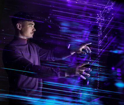 Software developer interacting with futuristic virtual interface