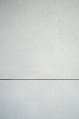 Fototapeta premium Light grey concrete wall with smooth seamless texture, perfect for modern architectural background.