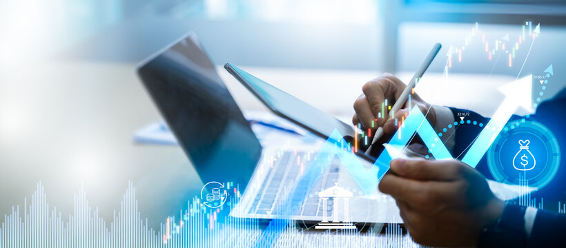 Business finance meeting and investment brainstorming concept.Businessman calculating and analyzing financial data report with business graph growth chart and world economic,Stock,Banking, Accounting.