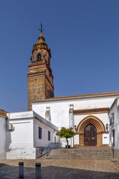 San Bartolome Church in Carmona, Spain, view of the historic facade. Gothic and baroque architecture, clear blue sky
