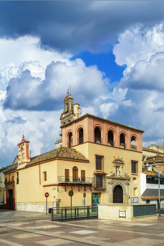 San Francisco Church in Ecija, Spain, view of the historic exterior. Traditional baroque architecture, cloudy grey sky