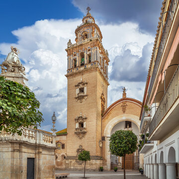 Santa Maria Church in Ecija, Spain, view of the historic building. Baroque architecture, soft cloudy sky