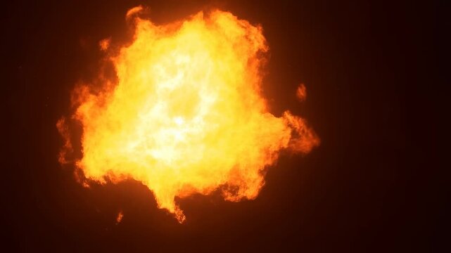 Explosive fireball erupting against a dark background. Captivating visual for action scenes, special effects, and dramatic storytelling