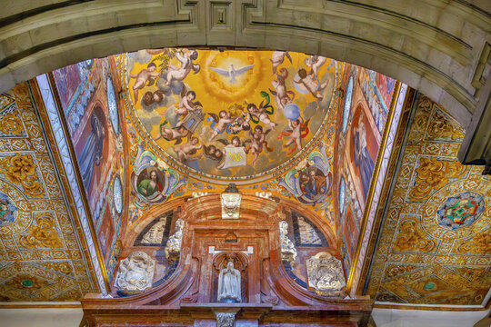 Interior of Mosque Cathedral of Cordoba, Spain. Ceiling view of small dome with Holy Spirit dove fresco, indoor light
