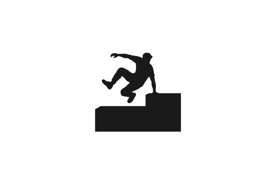 Man performing parkour jumping over obstacles silhouette