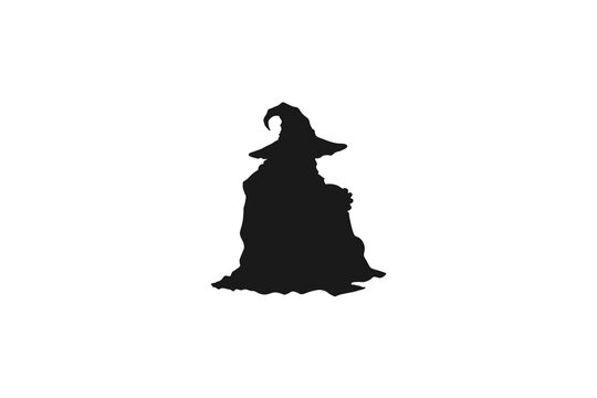 Spooky wizard silhouette wearing a long robe and pointed magic hat
