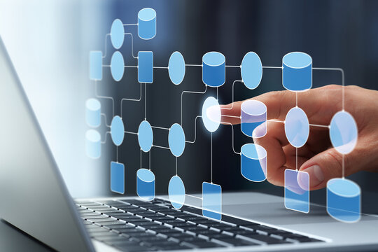 Data processing system. Data collection and transformation within network. Businessman tapping data flow diagram on laptop keyboard.