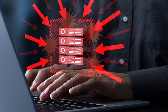 DDoS attack and system disruptions. Cyberattacks on network and cloud servers. Hacker using laptop computer.
