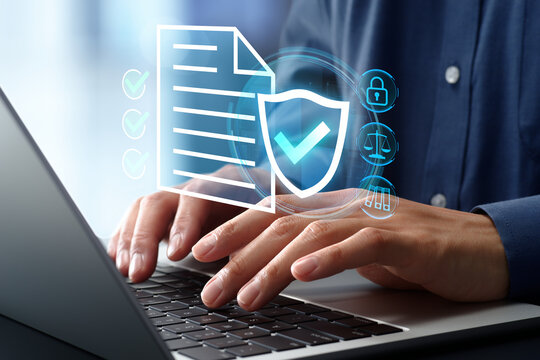 Legal and regulatory compliance policy. Corporate document verification and management system. Businessman using laptop computer.