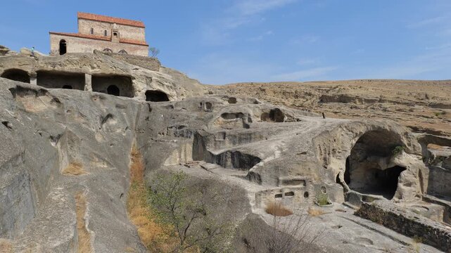 Uplistsikhe cave town near Gori city in Georgia. Ancient cave city Uplistsikhe at sunset in Georgia, UNESCO site.