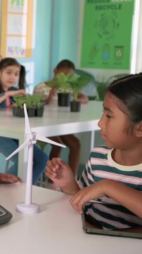 Class adjusting panel, turbine, tapping tablet, animation reacting to taps showing energy flow STEM