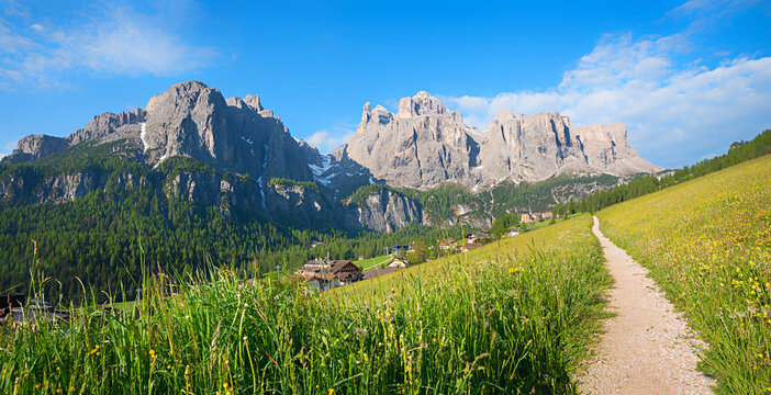 footpath near Colfosco, view to Sella group with Mittagstal valley. Dolomites alps south tyrol