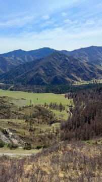 View of Chuysky Trakt valley from Chike Taman pass Altai Russia. Panoramic mountain valley landscape in Siberian region.