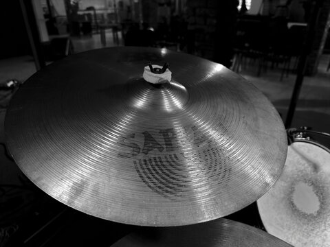Dnepr, UKRAINE 09.27.2024 : Black and white high angle view of a professional drum kit stage setup. Featuring Sabian cymbals, snare drum, and tom-tom with dampening tape. 