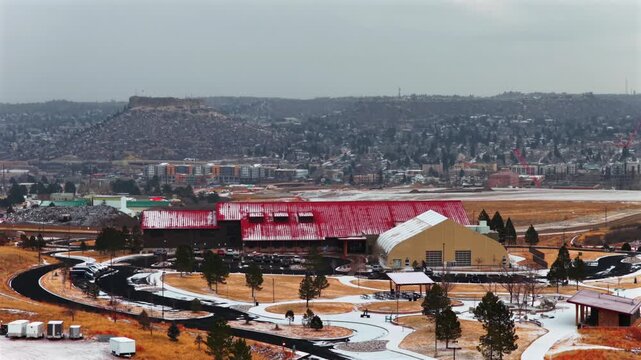 Town of Castle Rock downtown Mac Philip S Miller Park Athletic field Complex Rec Center winter cloudy day Castle Rock Colorado aerial drone Front Range Denver snow covered grounds upwards nib motion