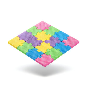 Colorful interlocking foam puzzle blocks arranged in a diamond shape on a surface