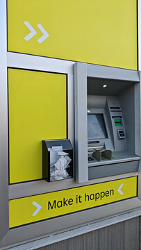 ATM machine with yellow background and motivational slogan  